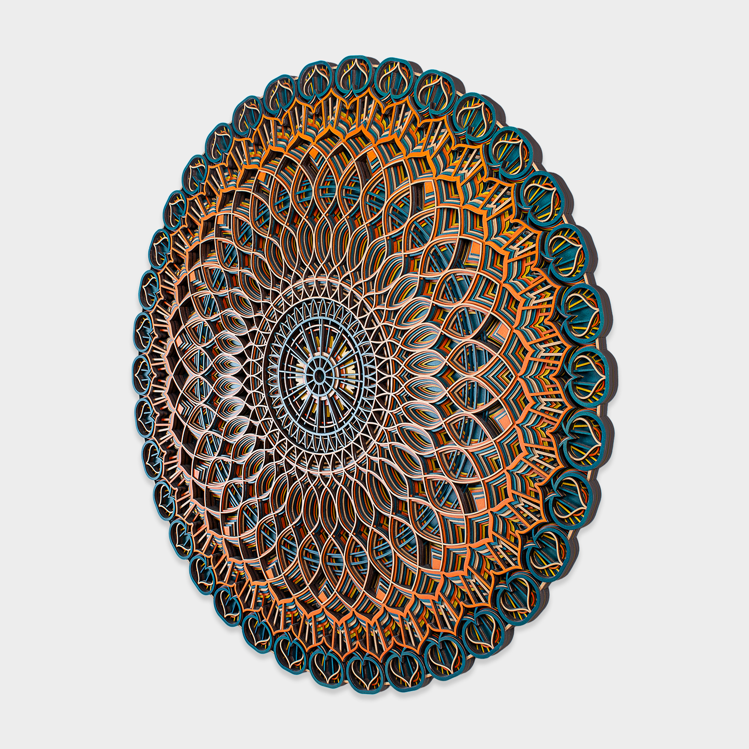 Geometric mandala wall décor with teal and orange detailing